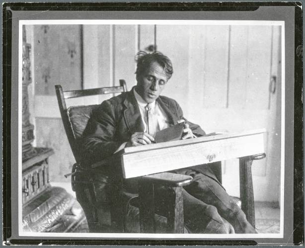 Black and white image of a young poet Robert Frost. 