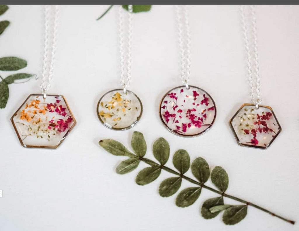 FLower necklaces with dried flowers to represent birth months. 