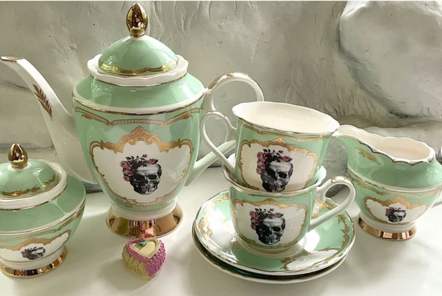 Beautiful tea party porcelain set with skull accents. 