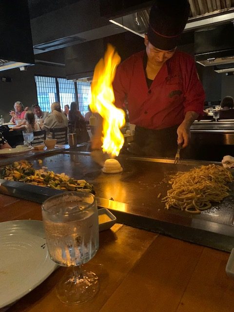 Hibachi chef demonstrating dinner in a restaurant. 