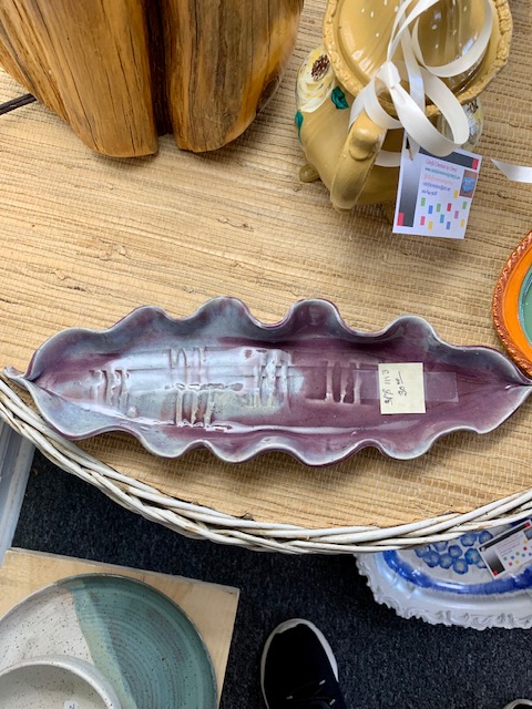 Scallop edged purple pottery tray. 