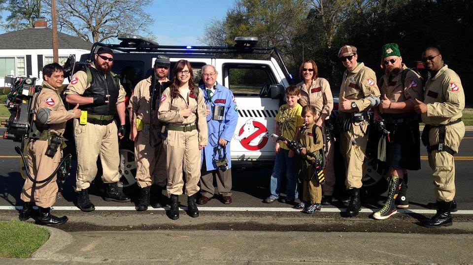 Group shot of cosplayers dressed as ghostbusters. 